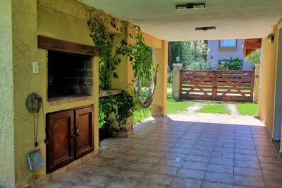 an empty entry way to a house with a fence at Sonnen Haus in Villa General Belgrano