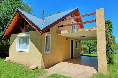 a house with a solar roof on top of it at Sonnen Haus in Villa General Belgrano