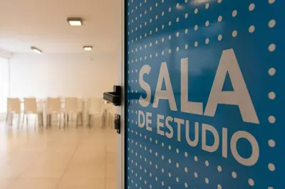 a door with a sale sign in a room with chairs at Nueva Córdoba Duomo in Cordoba