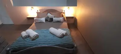 a bedroom with a bed with pillows on it at Aires de Ambar in Merlo
