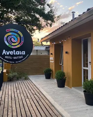 a building with a sign for a music studio at Hostel Avetaia in Santa Rosa de Calamuchita