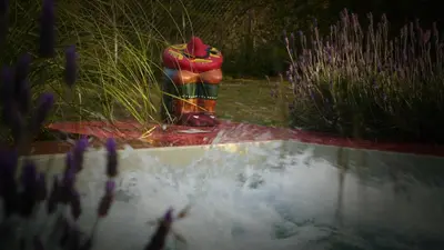 a fire hydrant sitting in the middle of a garden at Samsara Traslasierra in Los Hornillos
