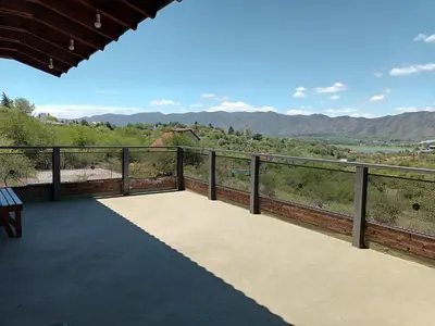 a balcony with a view of the mountains at Cañada Al Lago in Villa Parque Siquiman