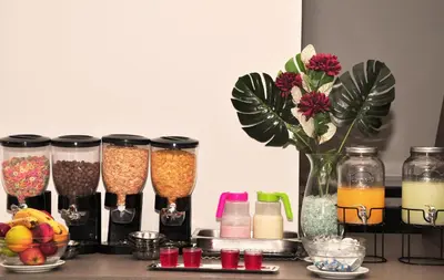 a table with a bunch of different types of drinks at Hotel Linz in Villa Carlos Paz