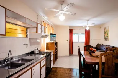 a kitchen with a sink and a counter top at Carlos Paz Departamentos in Villa Carlos Paz