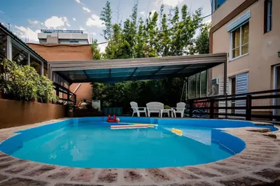a swimming pool in the backyard of a house at Carlos Paz Departamentos in Villa Carlos Paz