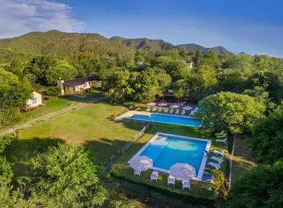 an aerial view of a house with a swimming pool at La Faustina Casas de Campo in Villa General Belgrano