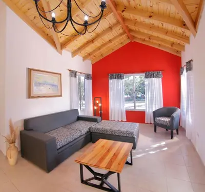 a living room with a couch and a table at La Faustina Casas de Campo in Villa General Belgrano