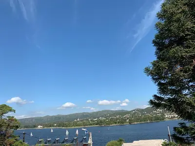 a view of a lake with sailboats on the water at lacasonavistalago in Villa Carlos Paz