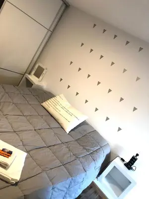 a bedroom with a bed in a room at Departamentos Mediterraneo in Cordoba