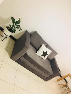 a couch sitting on the floor in a room at Departamentos Mediterraneo in Cordoba