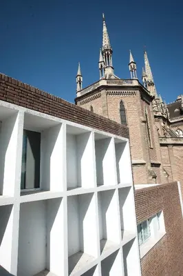 a white building with a building with a tower at Buen Pastor Capuchinos in Cordoba