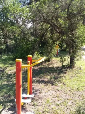 a fire hydrant with a hula hoop in a park at Campo de los Zorros in Nono