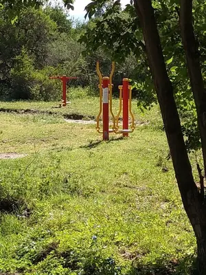 a park with red and yellow barriers in the grass at Campo de los Zorros in Nono