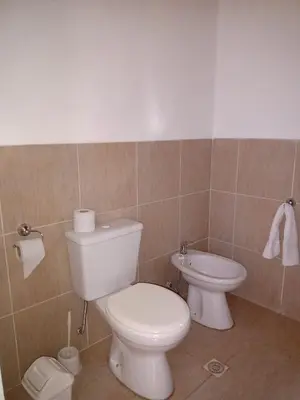 a bathroom with a toilet and a bidet at Campo de los Zorros in Nono