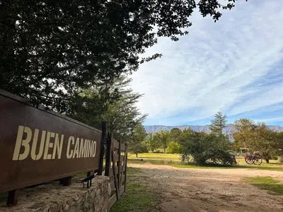 a sign for buern chamino in a park at Posada Buen Camino in Nono