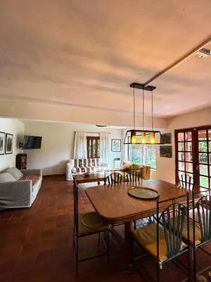 a living room with a table and a couch at Posada Buen Camino in Nono