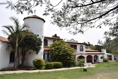 an image of a house with a tower at Estancia Santa Leocadia in Bialet Massé