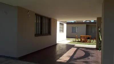 an empty hallway with a table in a house at Casa Fleming in Villa Carlos Paz