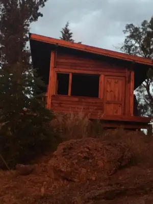 a cabin on the side of a hill at Cielo de Piedra. Cabañas y Petit Hotel in Tanti