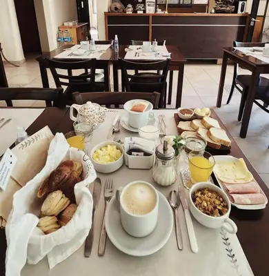 a table with breakfast foods and drinks on it at Posada Piedramora in Mina Clavero