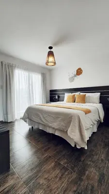 a bedroom with a large bed in a room at Posada Piedramora in Mina Clavero