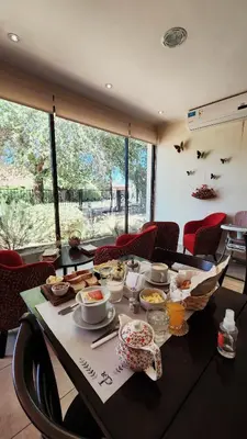 a table with a bunch of food on it at Posada Piedramora in Mina Clavero