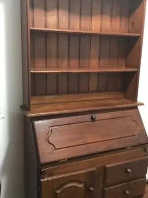 a wooden cabinet with a dresser in a room at Departamento en Nueva Cordoba in Cordoba