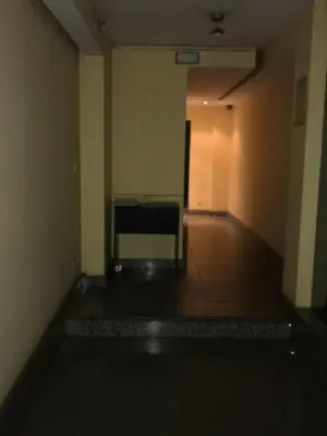 an empty hallway with a couch in a room at Departamento en Nueva Cordoba in Cordoba