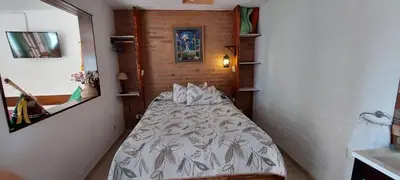 a small bedroom with a bed in a room at Balcon Al Paradiso in Santa Rosa de Calamuchita