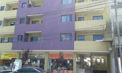 a purple building on the side of a street at Aires de la Villa II in Villa Carlos Paz