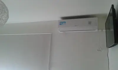 a room with a air conditioner on the wall at Aires de la Villa II in Villa Carlos Paz