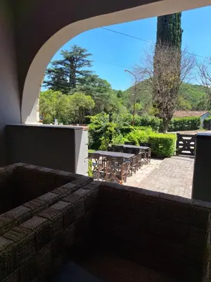 a view of a patio with a table and chairs at Posada Del Angel in Villa Serranita