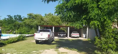 two cars parked in a garage next to a pool at Apart y Suite Portal del Luz in Mina Clavero