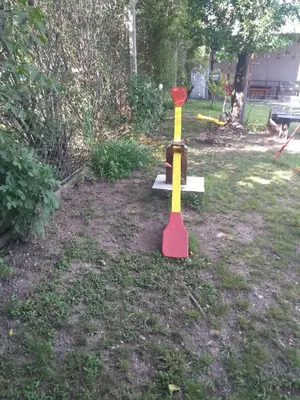 a red and yellow tee ball in a yard at Cabañas Brisas Del Mirador in Bialet Massé