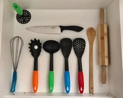 a bunch of utensils are hanging on a wall at Sierras Encantadas Cabañas in Panaholma