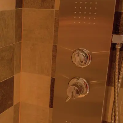 a shower with two knobs in a shower stall at Lake Point Residencias in Villa Parque Siquiman
