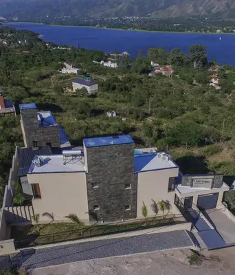 arial view of a house with a view of the water at Lake Point Residencias in Villa Parque Siquiman