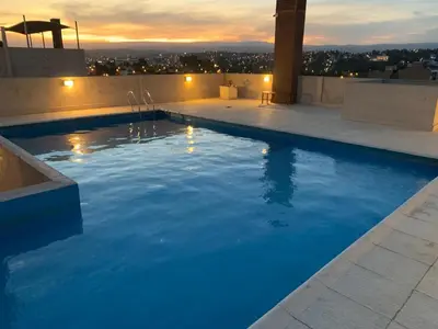 a swimming pool on the roof of a building at Edificio Hipolito Irigoyen in Villa Carlos Paz