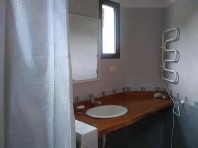 a bathroom with a sink and a mirror at Casas Altas VGB in Villa General Belgrano