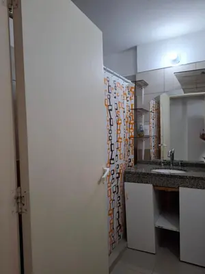 a bathroom with a sink and a mirror at Departamento Eutico in Villa Carlos Paz