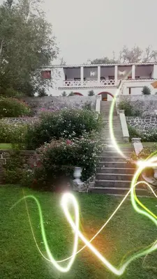 a group of lights on the grass near some stairs at El Cortijo de la villa in Villa Independencia