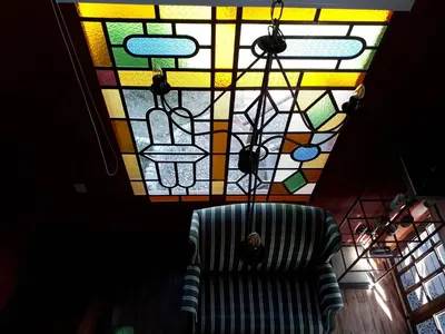 a room with a chair and a stained glass ceiling at Quinta Santana in José de la Quintana