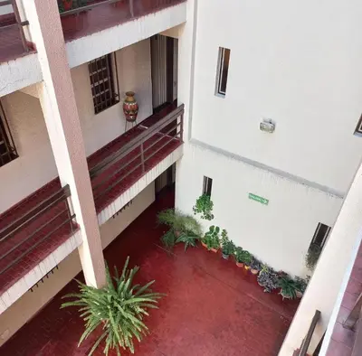 an overhead view of a courtyard of a building with plants at Edificio Trebol - Departamento en pleno centro de Carlos Paz in Villa Carlos Paz