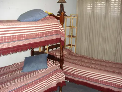 two beds sitting next to each other in a bedroom at Casa Villa Carlos Paz in Villa Carlos Paz