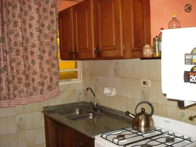 a kitchen with a tea kettle on top of a stove at Casa Villa Carlos Paz in Villa Carlos Paz