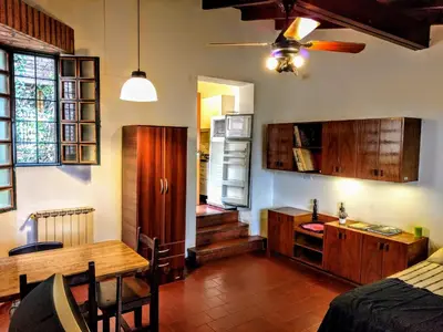 a kitchen with a table and a dining room at Cozy apartment in Cordoba in Cordoba