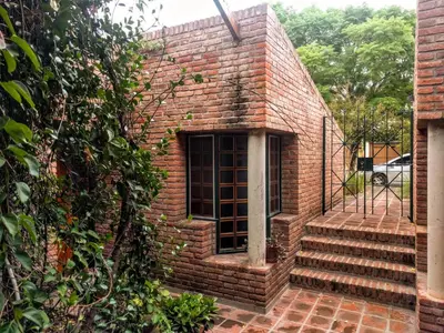 a brick building with a window and stairs at Cozy apartment in Cordoba in Cordoba