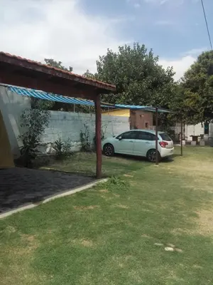 a car parked under a cover in a yard at Rocio de Luna in Mina Clavero