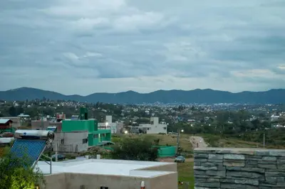 a view of a city from the roof of a building at Sierras Apartamentos in Villa Santa Cruz del Lago